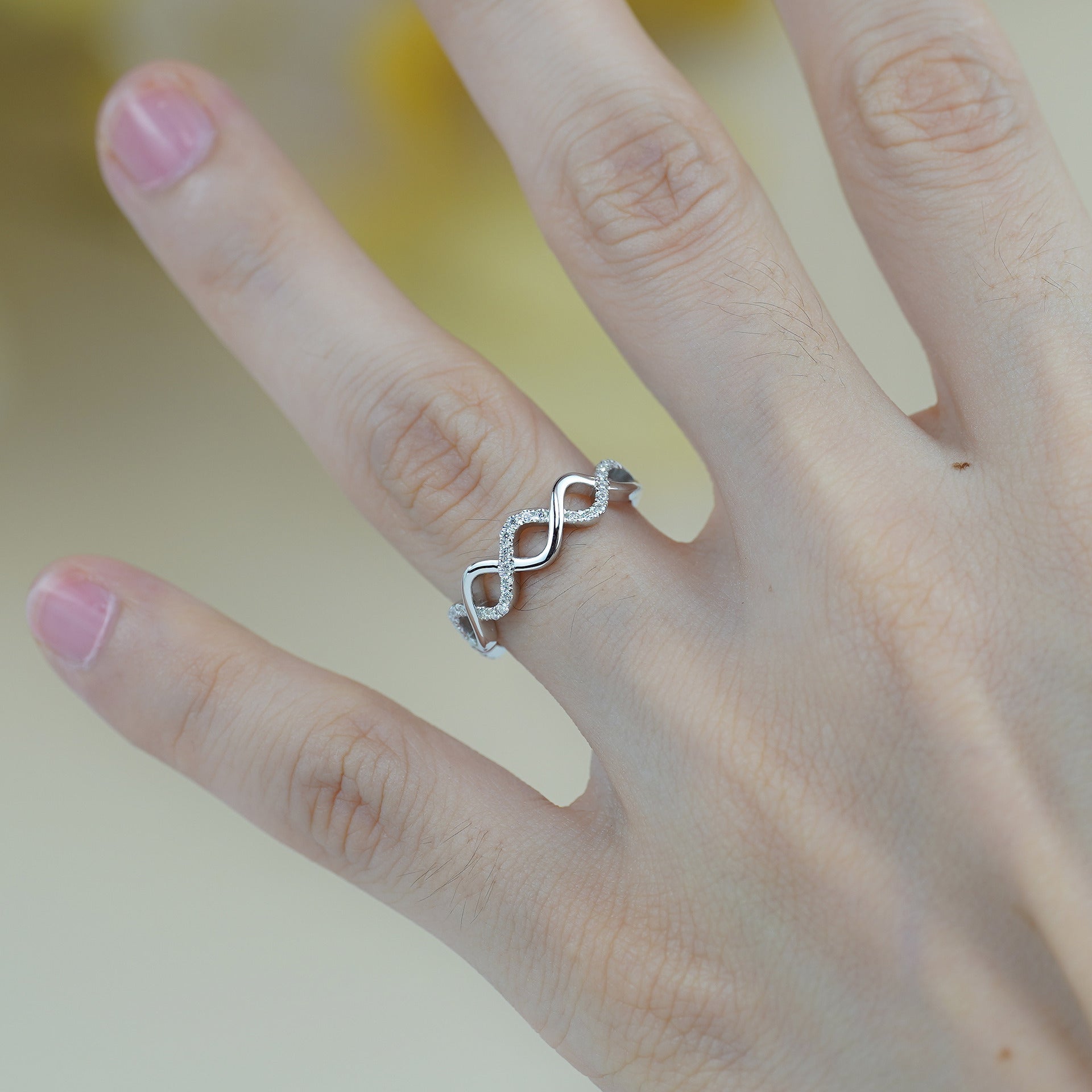 IE0041 MOISSANITE DIAMOND INFINITY RING IN STERLING SILVER