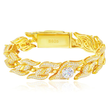 Gold bracelet with diamond accents on a white background