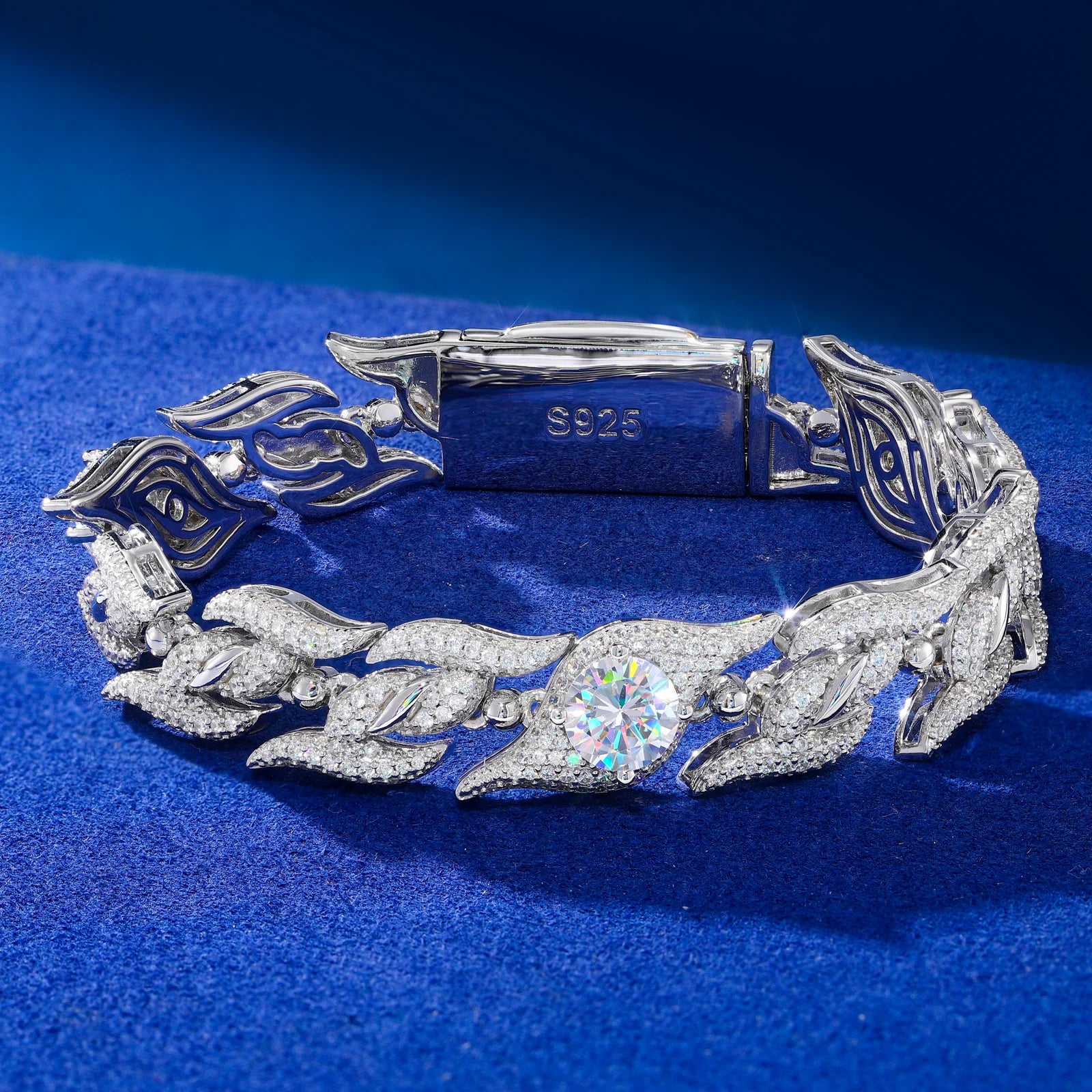 Silver bracelet with leaf designs on a blue background