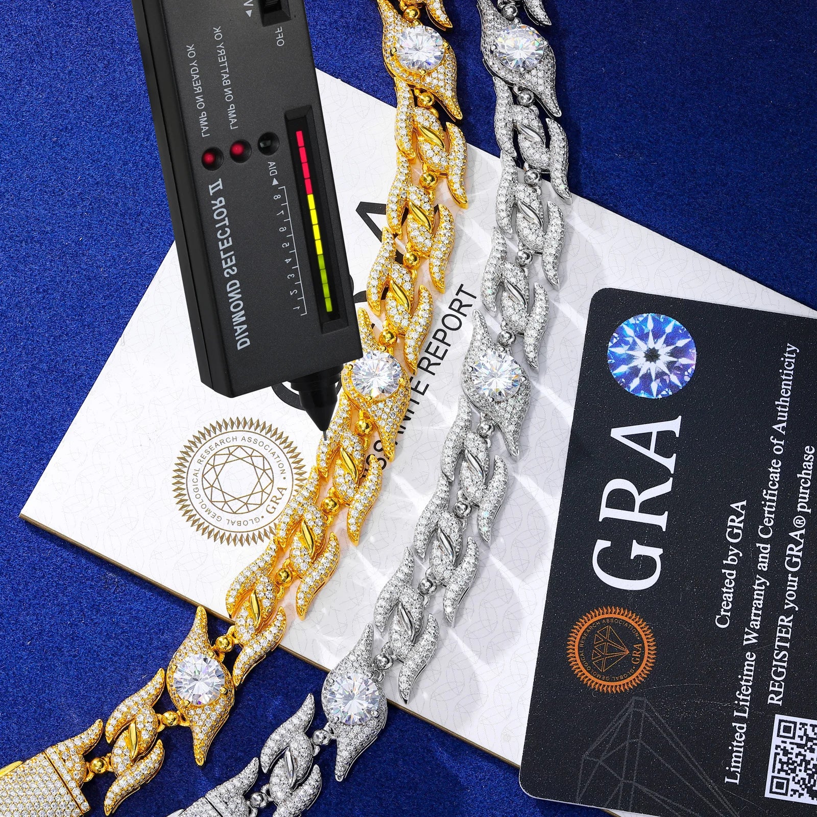 Gold and silver bracelets with a diamond检测器 and GRA certificate on a blue background