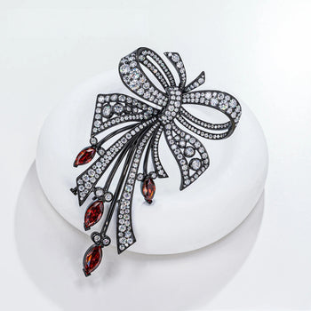 18K WHITE GOLD PLATED MOISSANITE CRIMSON ELEGANCE BOW BROOCH IN STERLING SILVER