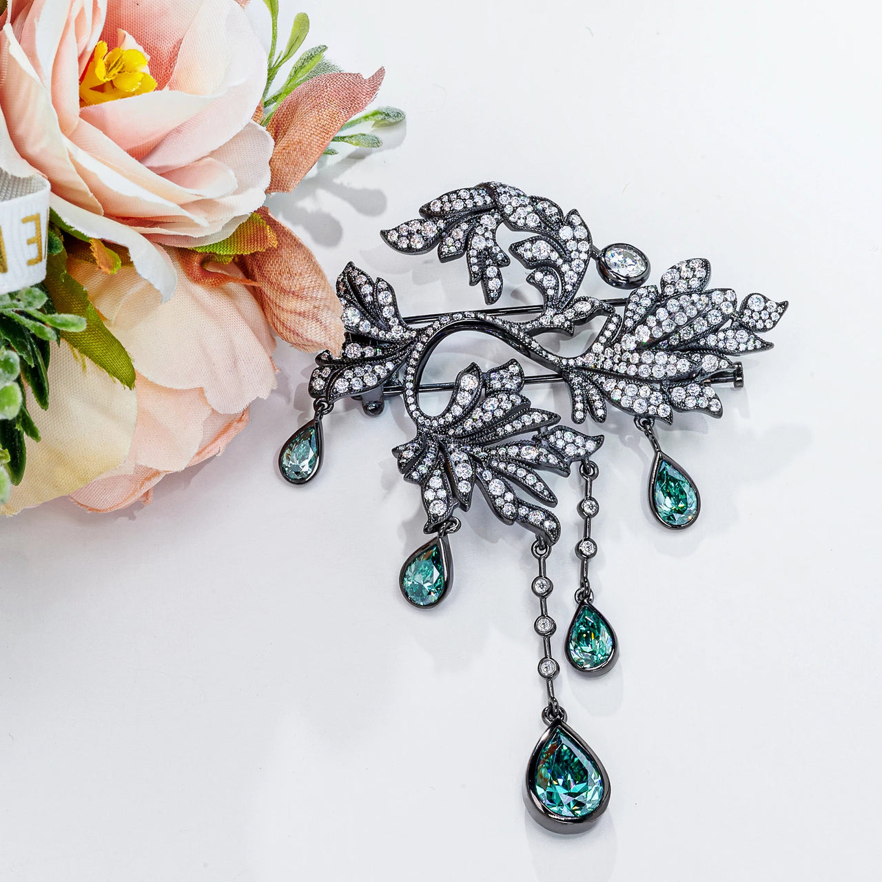 18K WHITE GOLD PLATED MOISSANITE EMERALD DEWFALL BROOCH IN STERLING SILVER