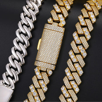 Gold and silver chain bracelets on a black background