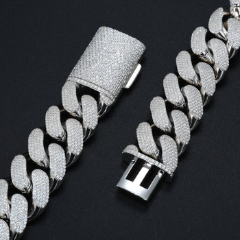Silver chain bracelet with diamond-like stones on a black background