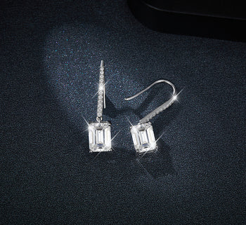 2CT MOISSANITE EMERALD CUT DROP EARRINGS IN STERLING SILVER