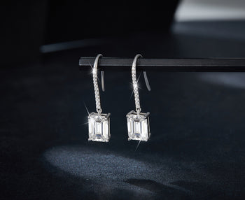 2CT MOISSANITE EMERALD CUT DROP EARRINGS IN STERLING SILVER