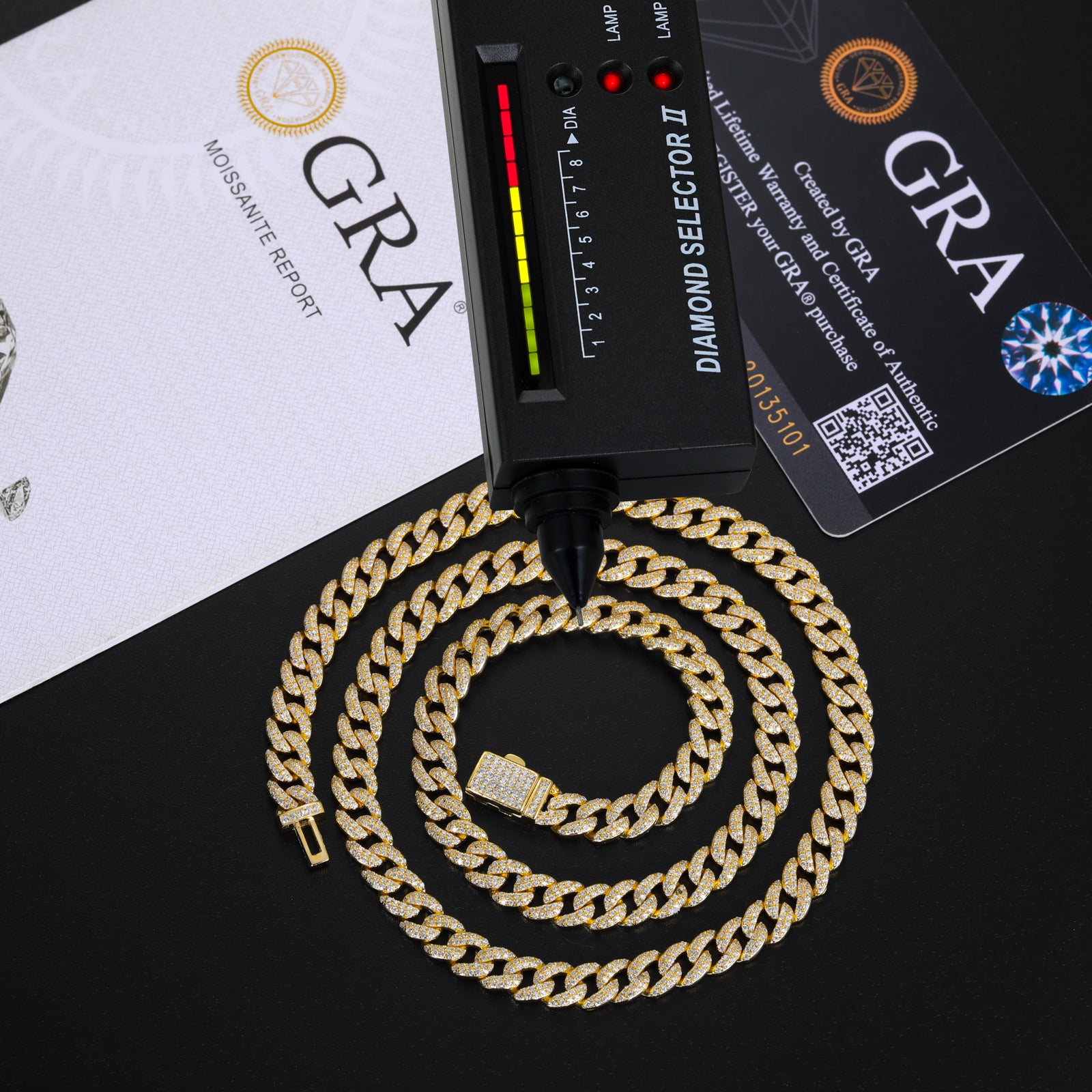 Gold chain with GRA diamond selector and certification on a black background