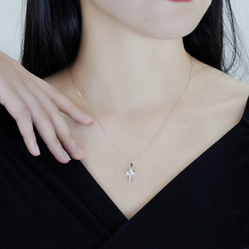 ALL MOISSANITE BEZEL CROSS PENDANT IN STERLING SILVER