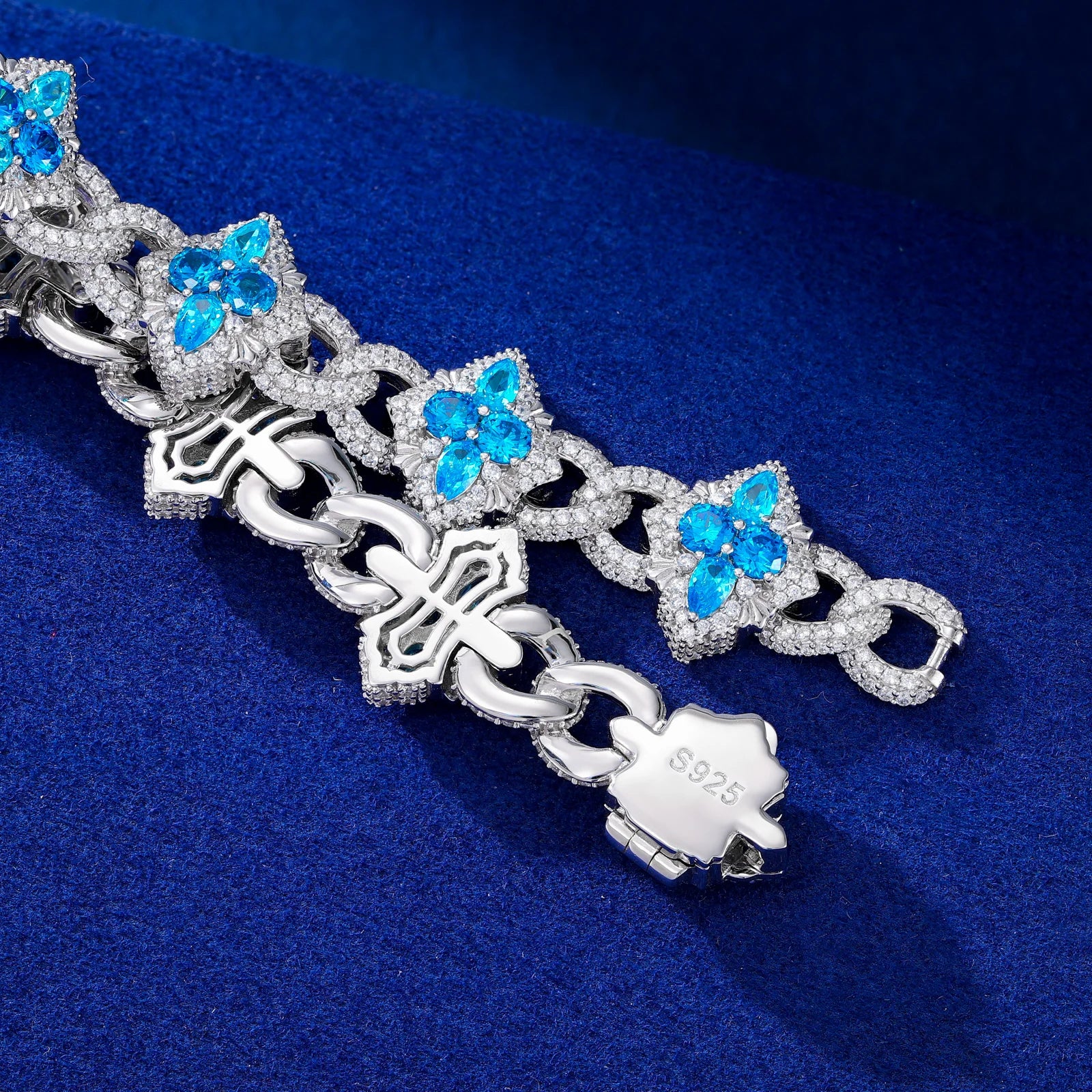 Silver bracelet with blue gemstone butterflies on a blue background