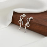 BOW TIE RIBBON STUD EARRING IN STERLING SILVER