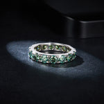 GREEN ROUND MOISSANITE ETERNITY BAND RING IN STERLING SILVER