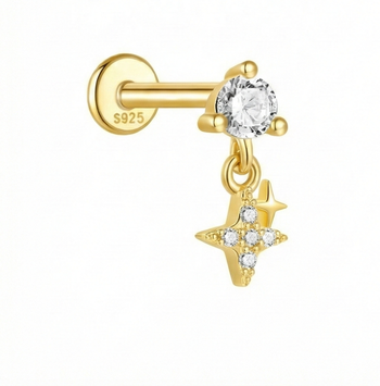 Gold earring with star and gemstone charm on a white background