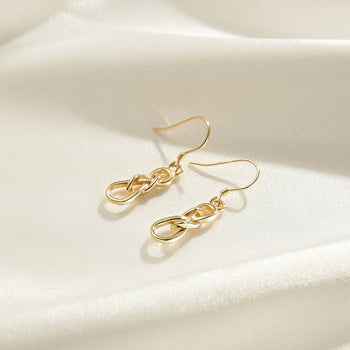 BOUCLES D'OREILLES PENDANTES À NŒUD CELTIQUE EN ARGENT MASSIF