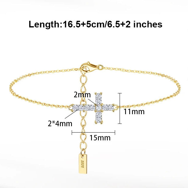 Gold bracelet with cross charm and diamond details, featuring product specifications on a white background.