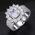 CUSHION CUT MOISSANITE FLOWER RING IN STERLING SILVER