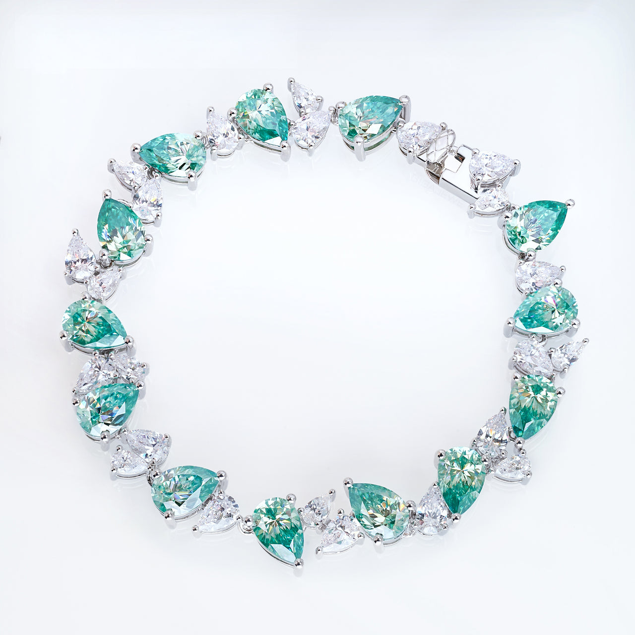 CYAN MOISSANITE PEAR CUT BRACELET IN SOLID GOLD