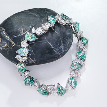 CYAN MOISSANITE PEAR CUT BRACELET IN SOLID GOLD