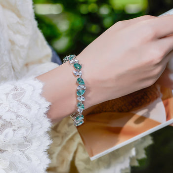 CYAN MOISSANITE PEAR CUT BRACELET IN SOLID GOLD