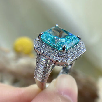 CYAN RADIANT CUT MOISSANITE ENGAGEMENT RING IN STERLING SILVER