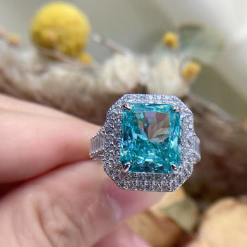 CYAN RADIANT CUT MOISSANITE ENGAGEMENT RING IN STERLING SILVER