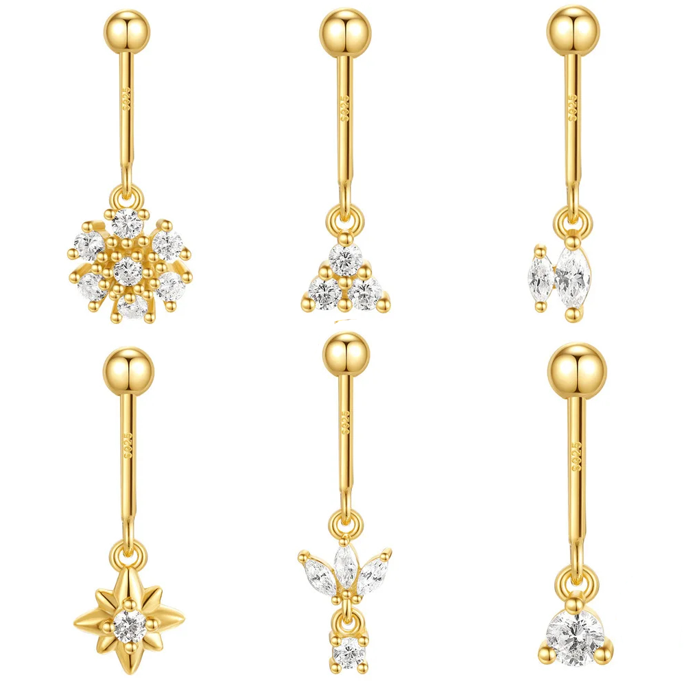 Set of gold earrings with various designs on a white background