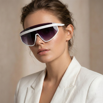 Woman wearing futuristic sunglasses with a neutral background