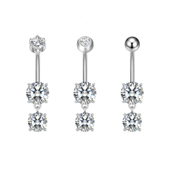 Pair of silver belly button rings with clear gemstones on a white background