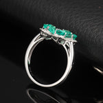 LAB GROWN EMERALD HALO FLOWER RING IN 18K WHITE GOLD