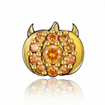 Gold and orange gemstone earring on a white background