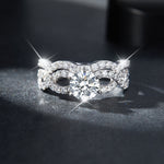 IE00220 FLOWER MOISSANITE ENGAGEMENT IN STERLING SILVER