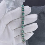 GREEN MOISSANITE PRINCESS SQUARE HEART EMERALD OVAL LINK CHAIN BRACELET IN STERLING SILVER