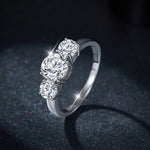 IE0098 THREE ROUND STONE MOISSANITE ENGANGEMENT RING IN STERLING SILVER