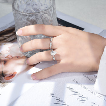 IE0359 2CT PEAR CUT MOISSANITE TWISTED SHANK RING IN STERLING SILVER