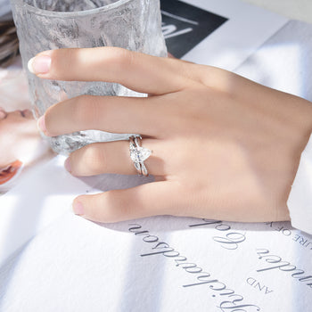 IE0359 2CT PEAR CUT MOISSANITE TWISTED SHANK RING IN STERLING SILVER