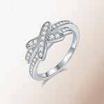 IE3004 KNOT MOISSANITE ENGANGEMENT RING IN STERLING SILVER