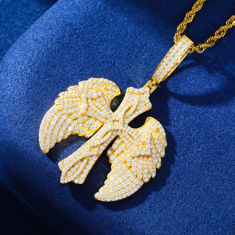 Gold pendant necklace on a blue fabric background