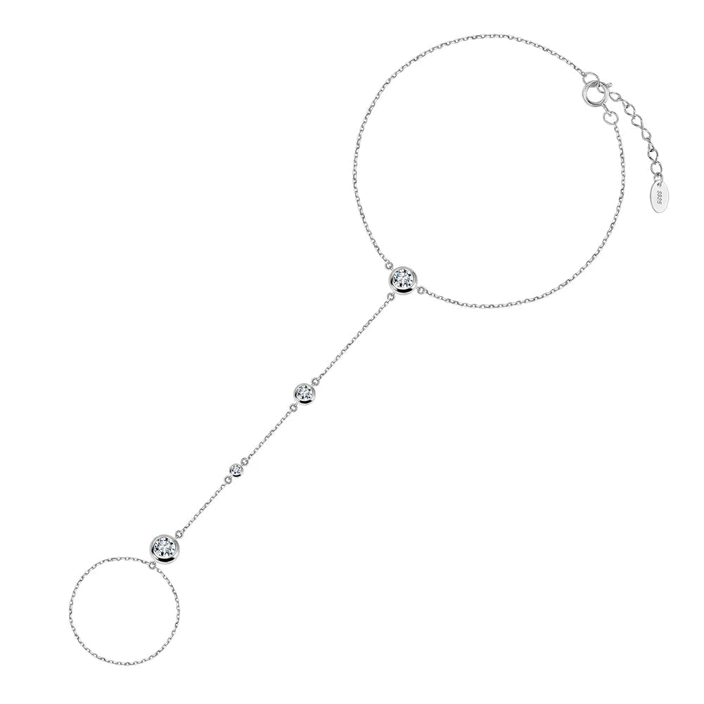 Sterling silver hand harness, hand chain, ring bracelet on a white background.