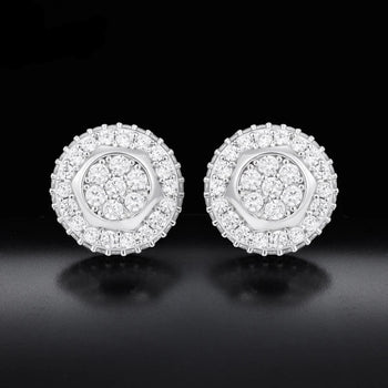 Pair of silver earrings with diamond-like stones on a black background