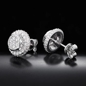 Pair of silver stud earrings with clear gemstones on a black background