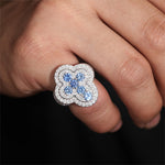 MOISSANITE DIAMOND AND BLUE CZ ICED OUT CROSS RING IN STERLING SILVER