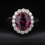 OVAL CUT LAB GROWN RUBY AND MOISSANITE HALO RING IN 9K SOLID GOLD