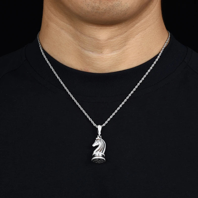 Silver necklace with a horse pendant on a black shirt
