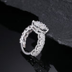 MOISSANITE DIAMOND HALO ENGAGEMENT RING IN STERLING SILVER