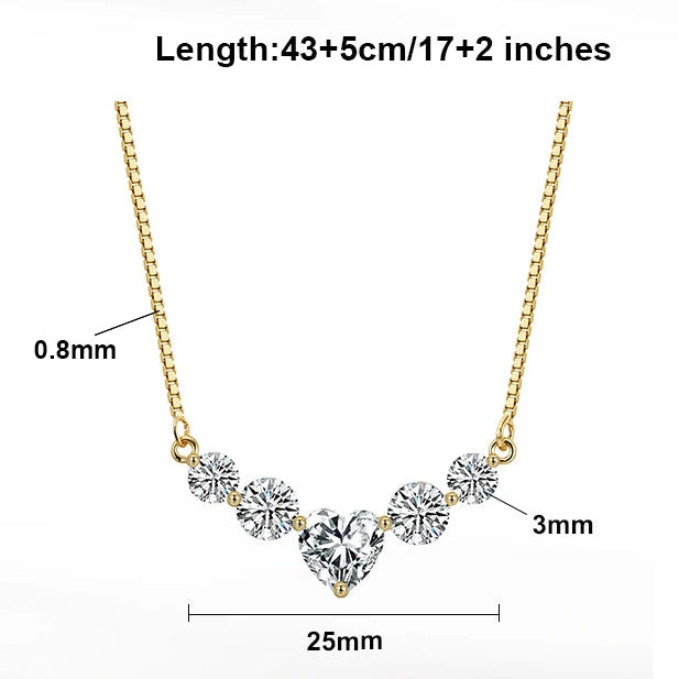 Gold necklace with diamond pendant on a white background, featuring product details.