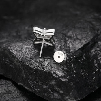 Boucles d'oreilles puces en forme d'étoile à quatre branches serties de diamants et de moissanite, en argent sterling