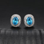 MOISSANITE DIAMOND ICED OUT OVAL STUD EARRINGS IN STERLING SILVER