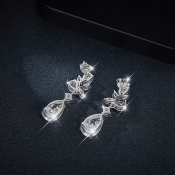 Boucles d'oreilles pendantes en forme de poire serties de diamants et de moissanite, en argent sterling