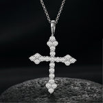 MOISSANITE DIAMOND TRI-STONE CROSS PENDANT IN STERLING SILVER