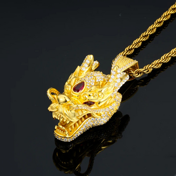 Gold dragon pendant necklace on a black background