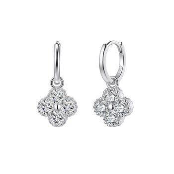Pair of silver earrings with floral design on a white background